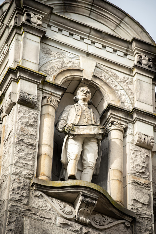 This statue of Captain James Cook is located on the exterior of the Legislative Library.
