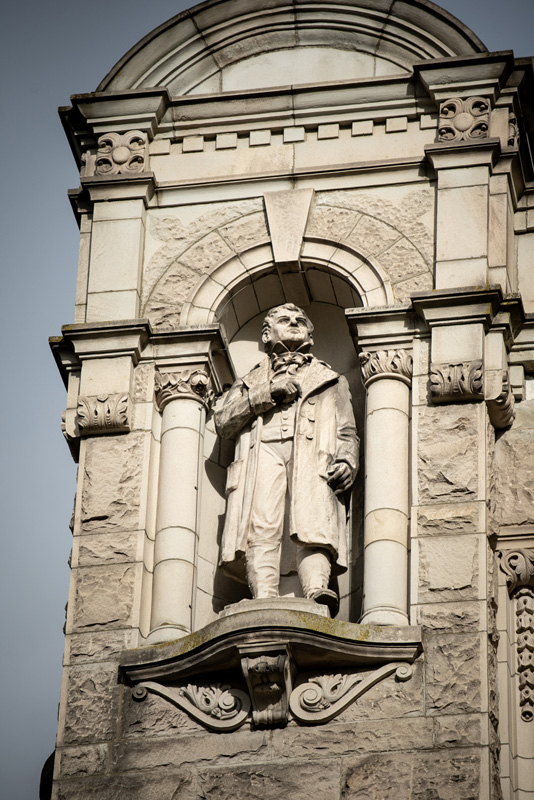 This statue of Simon Fraser is located on the exterior of the Legislative Library.