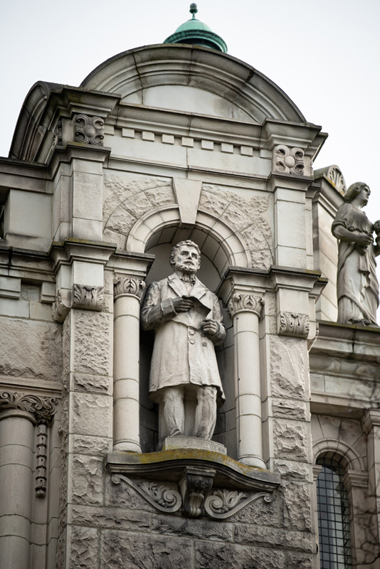 This statue of Lord Edward Bulwer-Lytton is located on the exterior of the Legislative Library.
