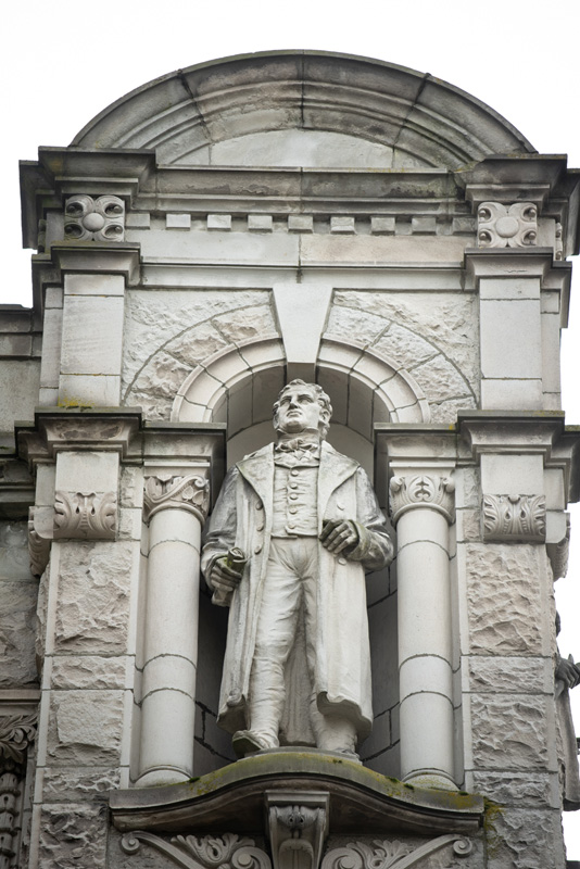 This statue of David Thompson is located on the exterior of the Legislative Library.