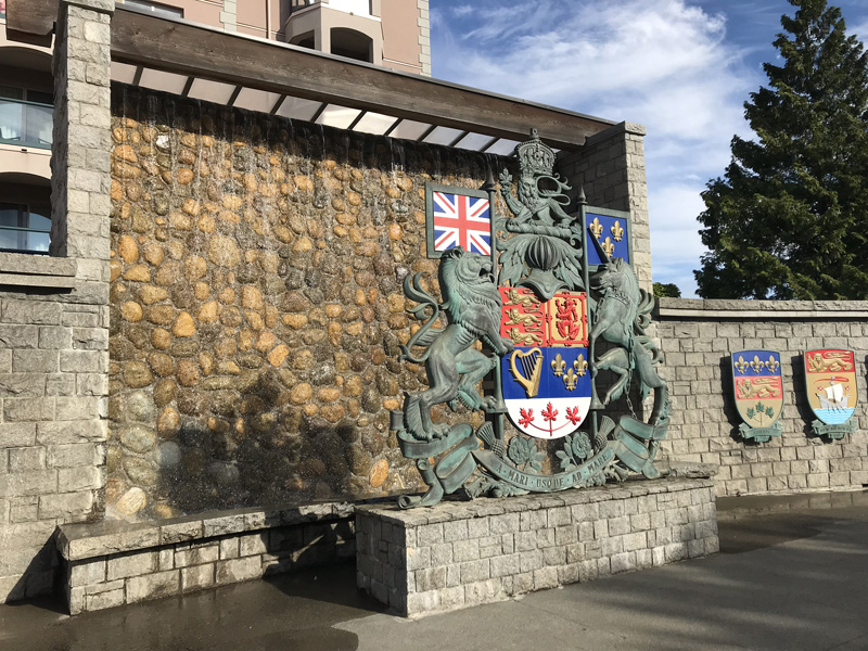 The Coat of Arms of Canada contains the Latin phrase "A Mari usque ad Mare," meaning "From Sea to Sea," at its base. This Coat of Arms is displayed in Confederation Garden Park, Victoria.