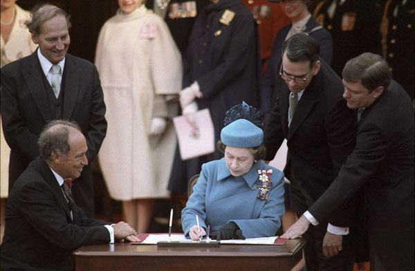 Queen Elizabeth II signing the Proclamation of the Constitution Act, 1982.