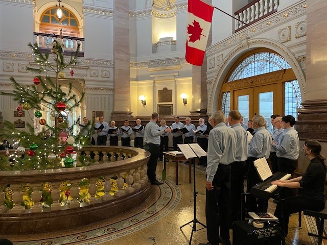 A choir singing in the upper rotunda of the Parliament Buildings in December.