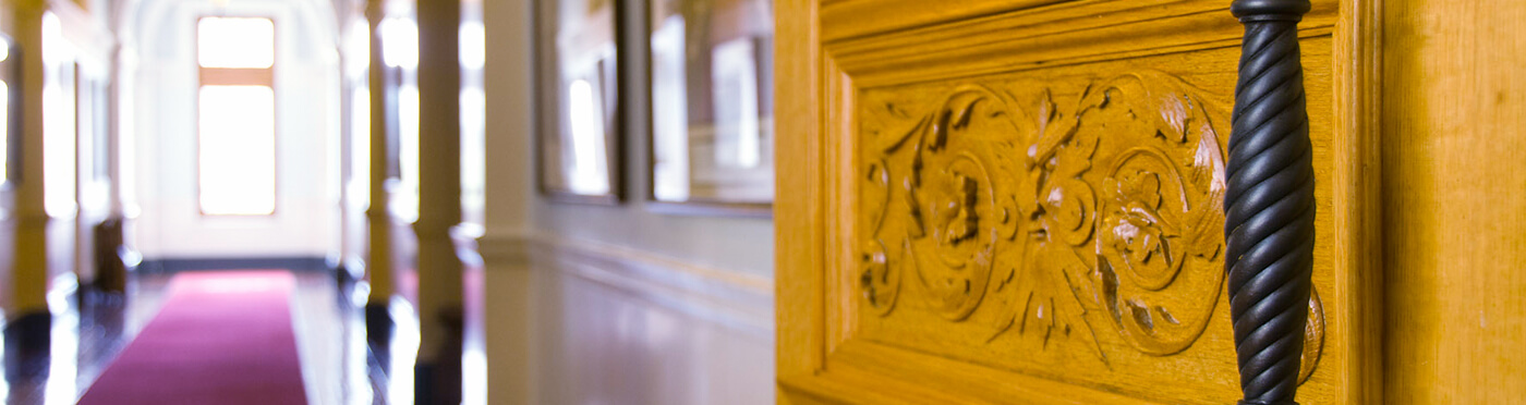  Ornate wooden door handle detail.