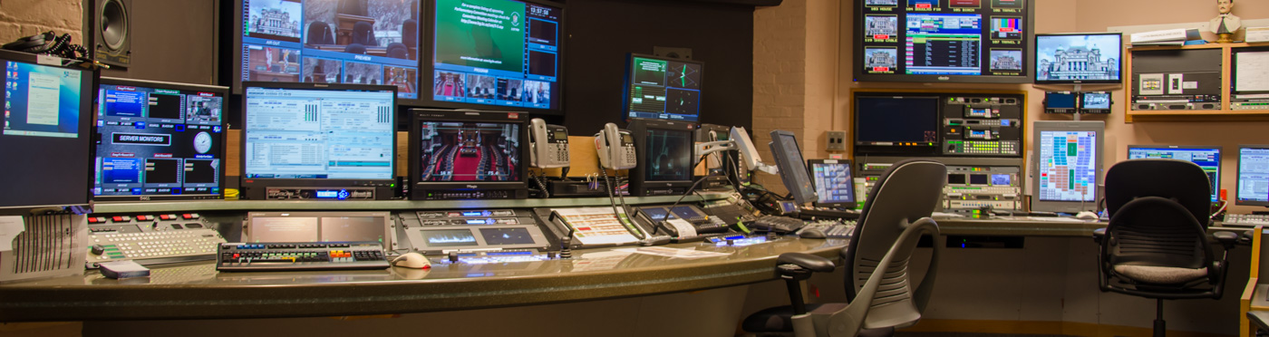 Broadcast control room with monitors.