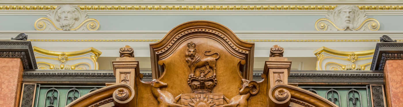  Carved wooden crest with lion.