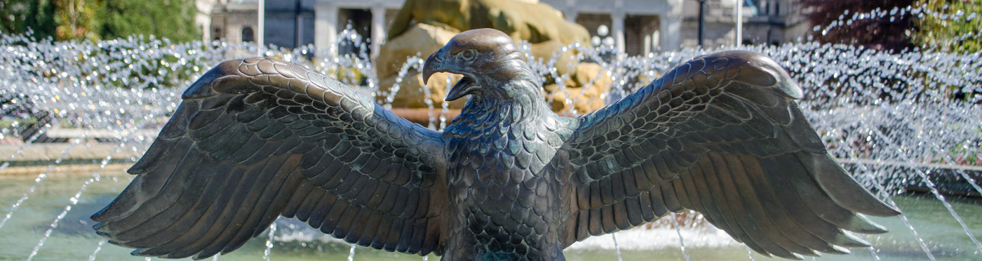 Bronze eagle statue in fountain.