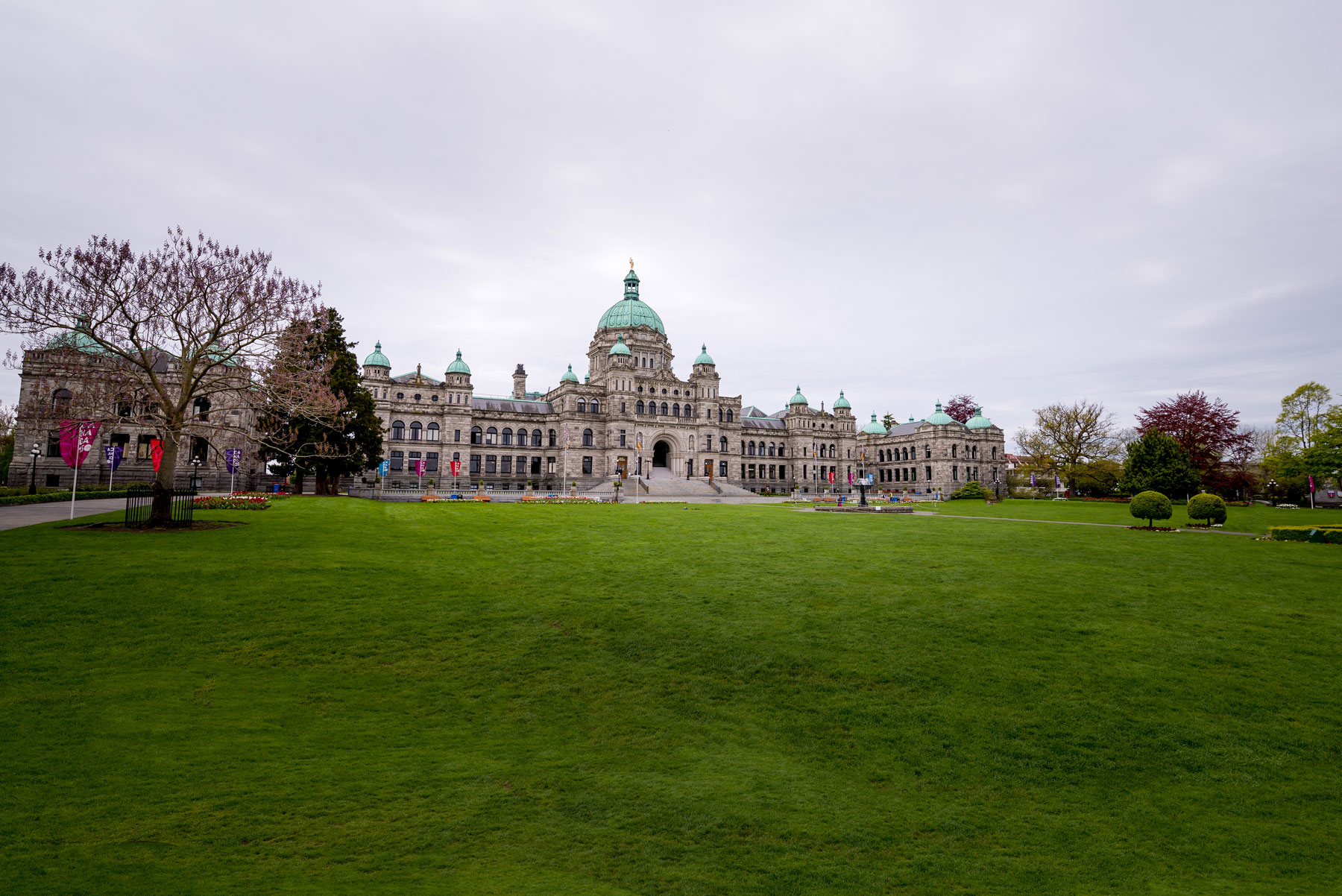 Image of the grass in front of the Legislative Assembly building, grey sky