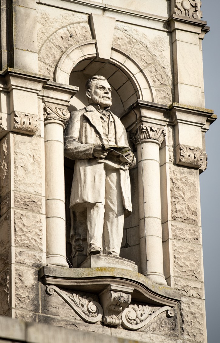 Dr. Helmcken statue on the exterior of the building